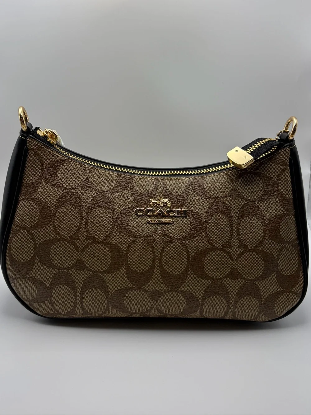 Coach Brown Signature Canvas Shoulder Bag with Black Trim and Gold Hardware